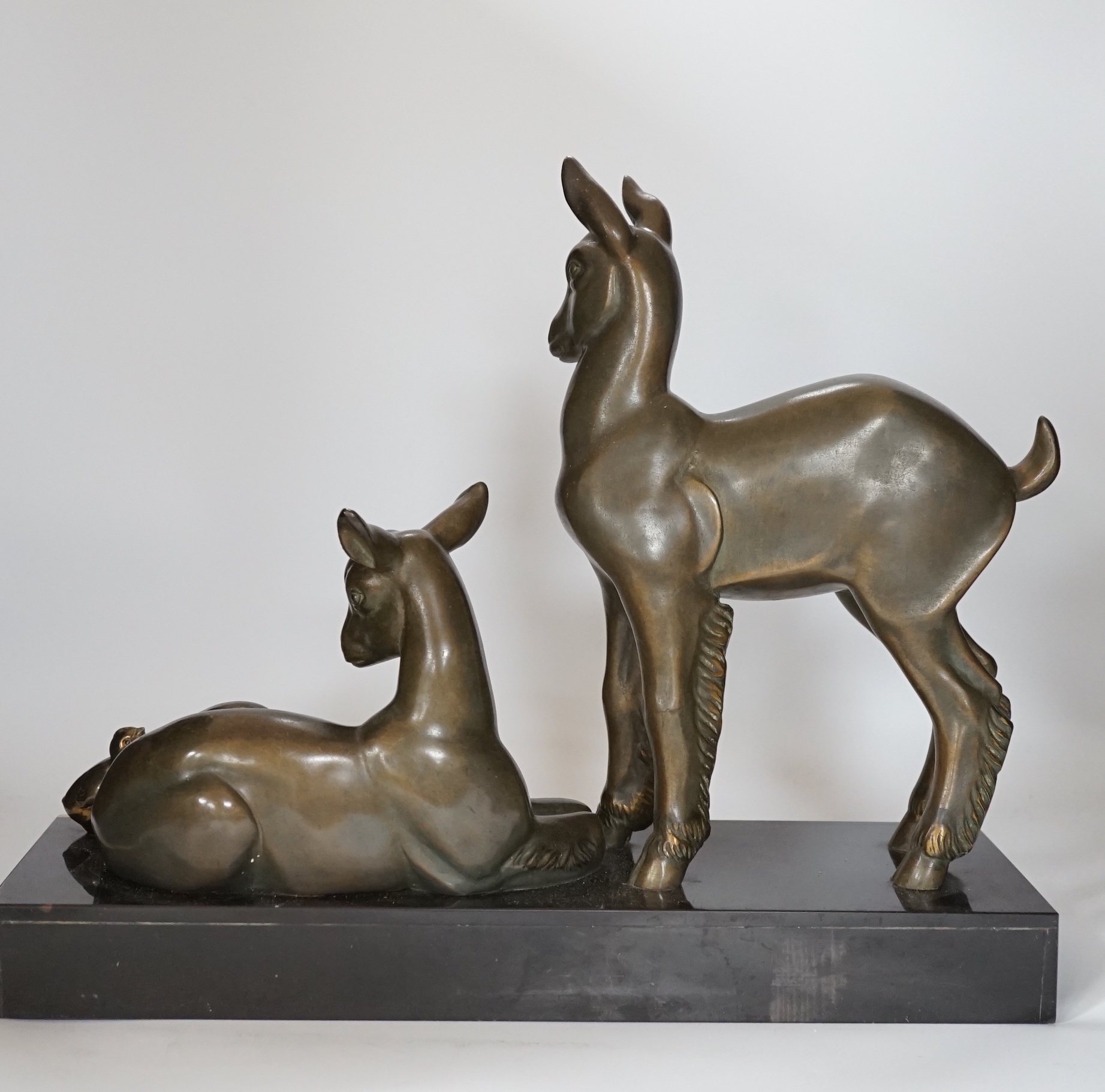 An Art Deco patinated spelter twin goat group on marble base, etched ‘Rochard’ on base, 36cm high